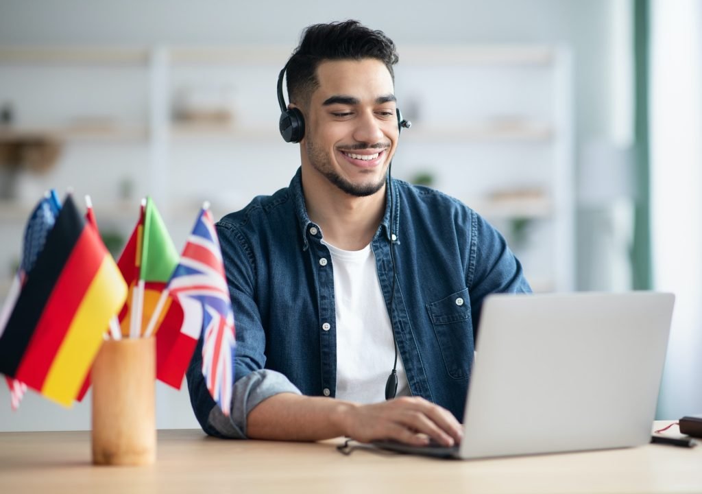 happy-arab-guy-student-learning-foreign-language-online-1.jpg